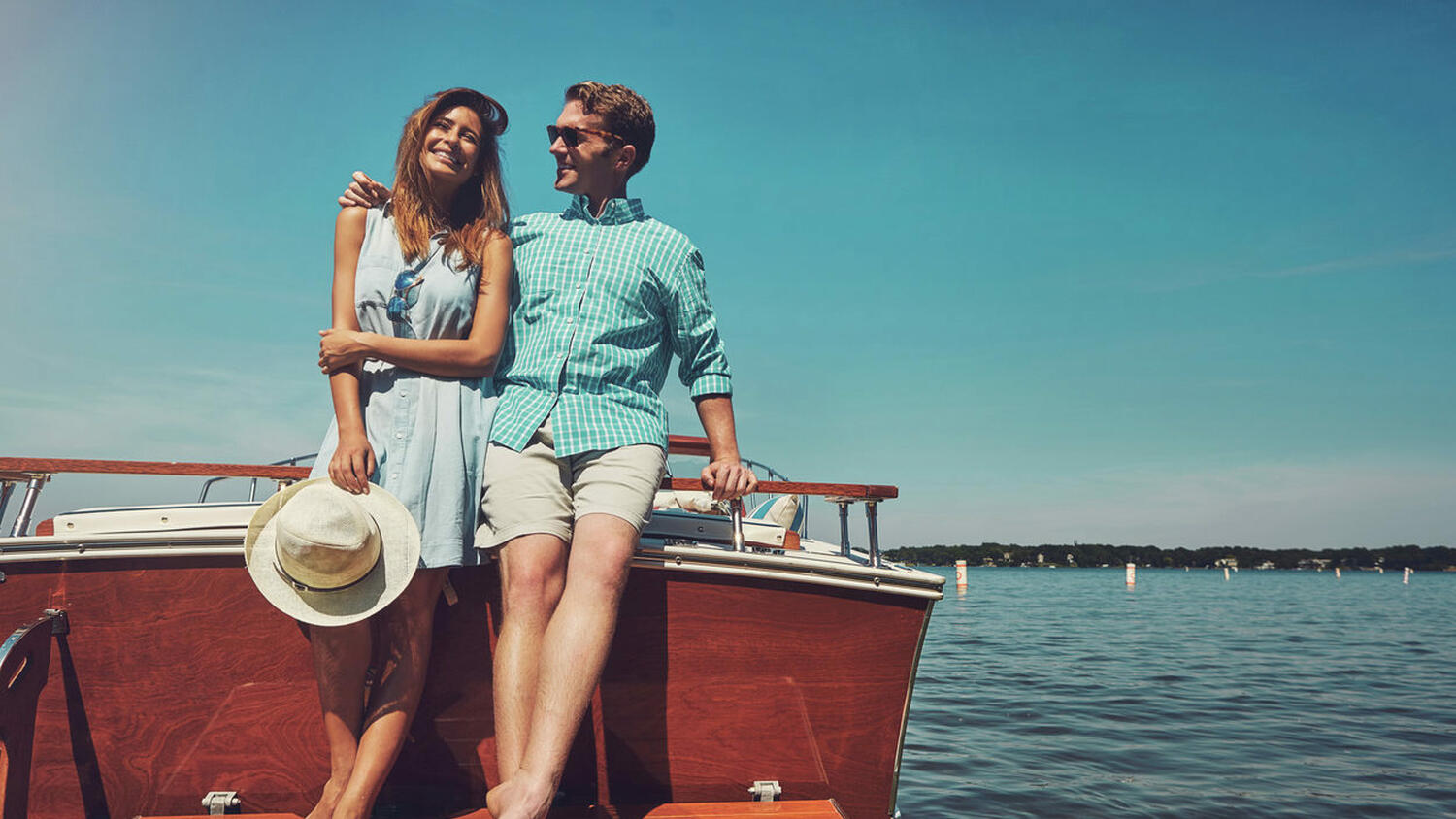 Man and a Woman Smiling on a Boat